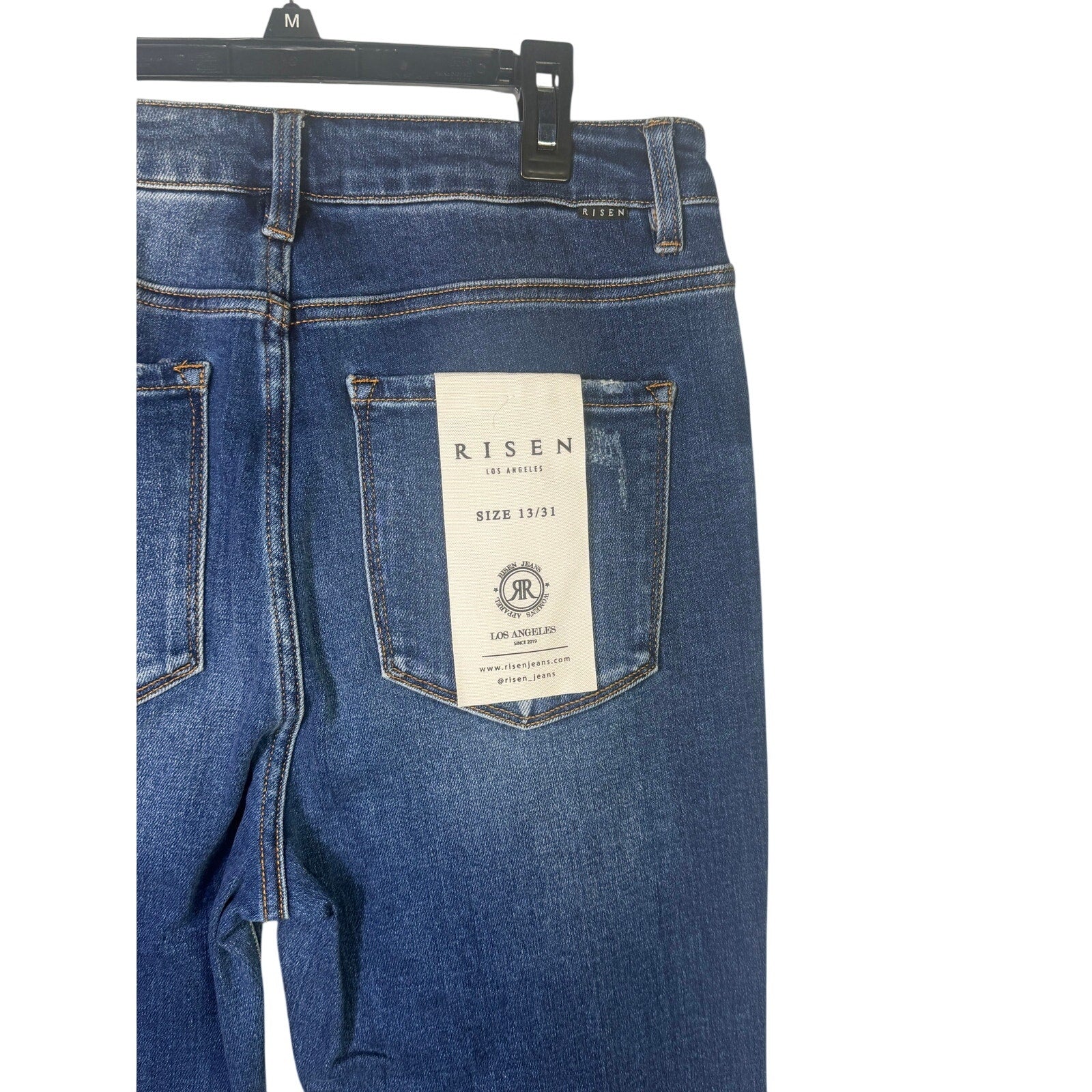 Risen Jeans women's size 13 dark wash distressed flare jeans, stylish and fitted with a trendy flare leg design.