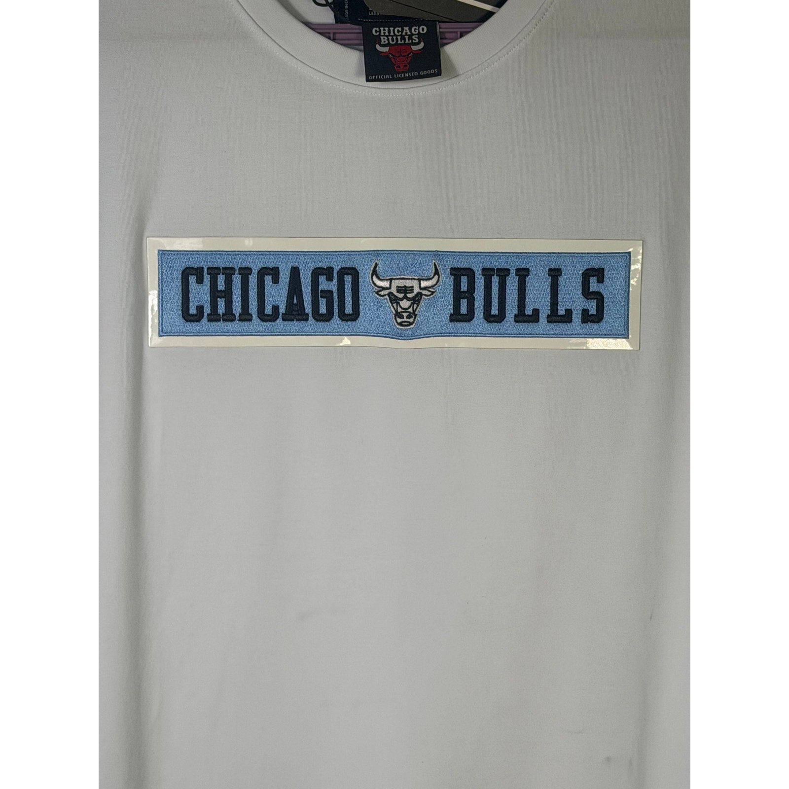 White NBA short sleeve T-shirt for men featuring Chicago Bulls logo, made by Pro Standard, with a classic athletic fit.