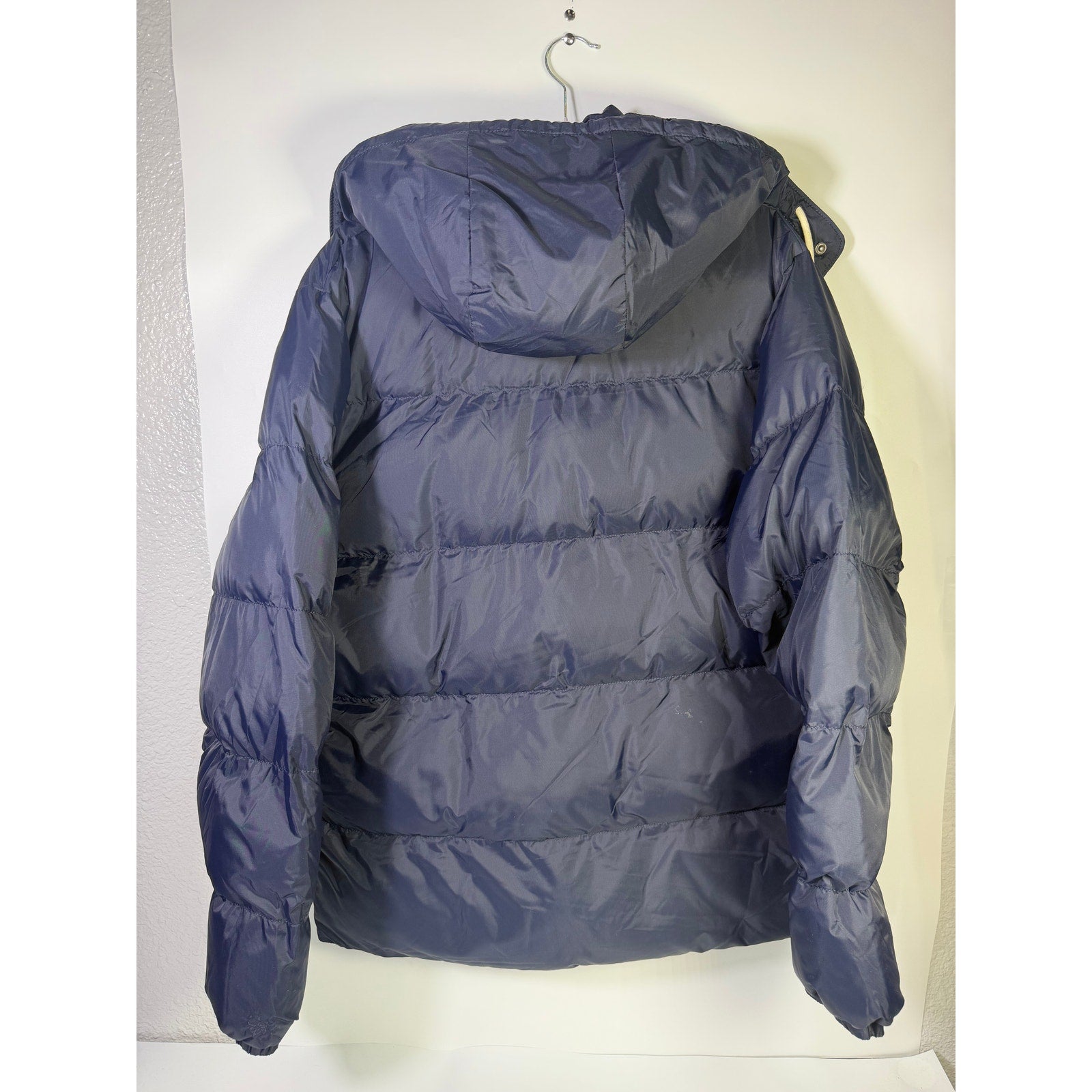 Alpine Design men's AD 1962 hooded puffer jacket in deep navy, size large, with quilted insulation and front zipper.