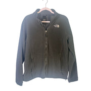 The North Face women's black full-zip fleece jacket with outdoor logo, showcasing a cozy, full-zip design and logo details.