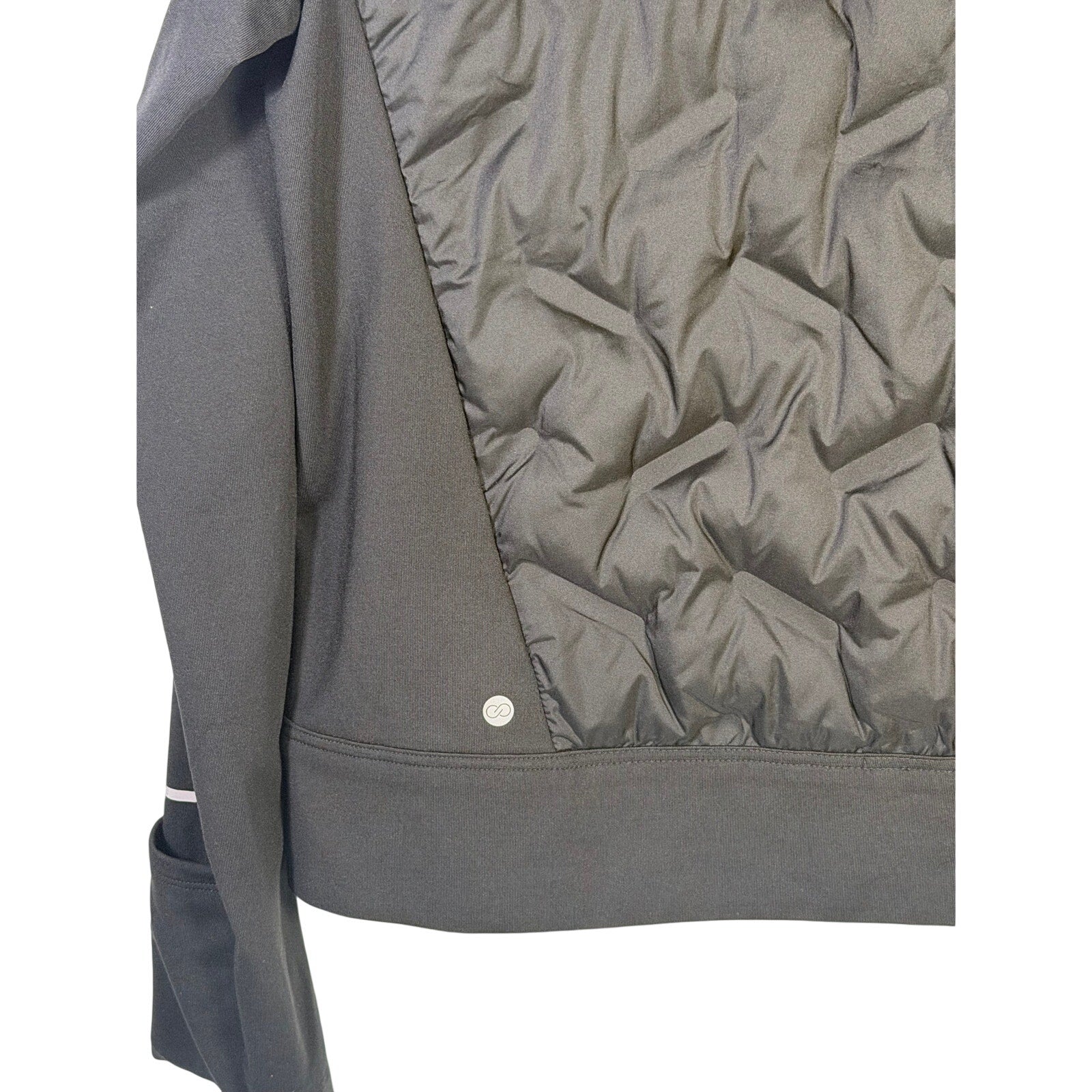 CALIA women's Cold Dash Run Jacket in pure black, medium size, hybrid quilted design, suitable for cold weather running.