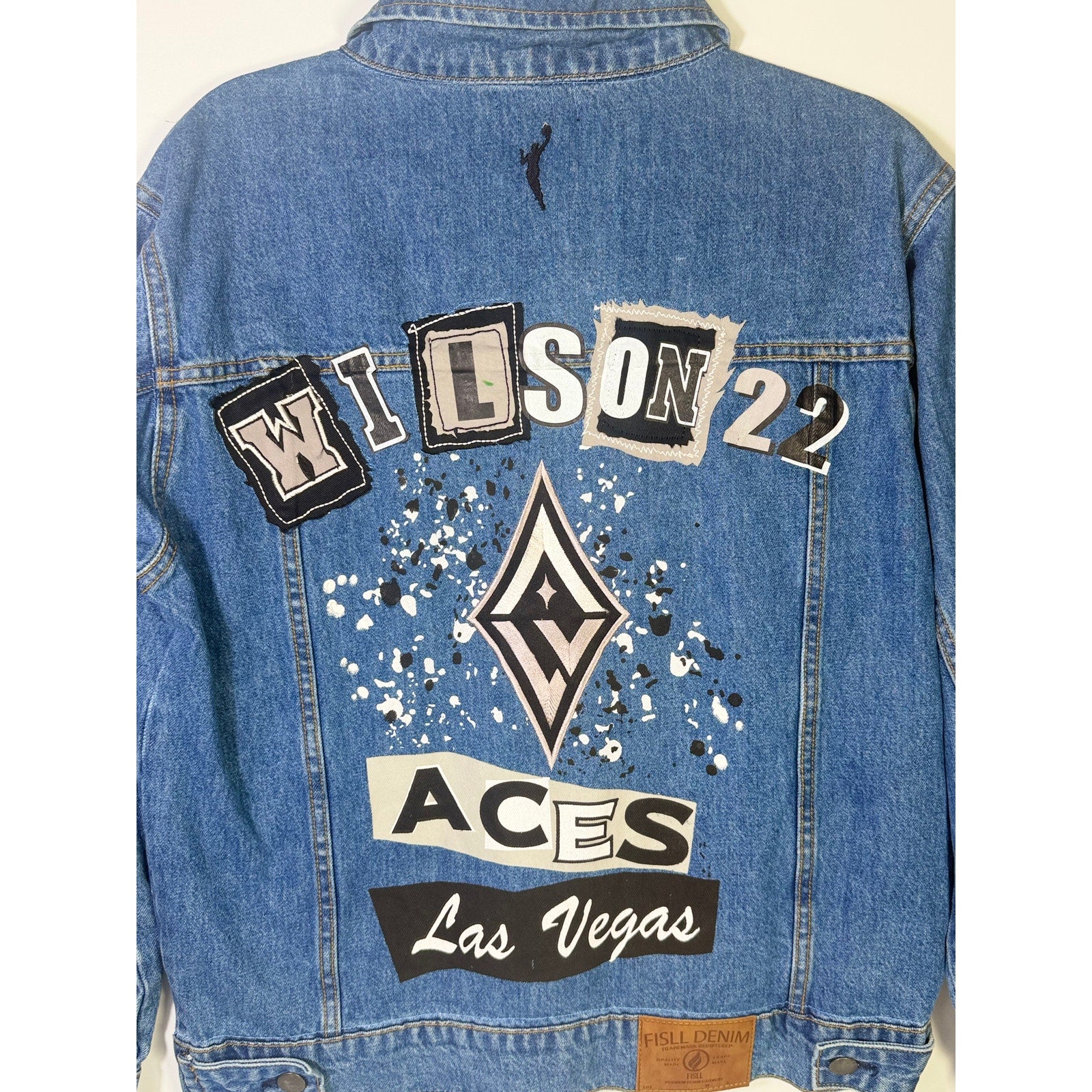 FISLL Las Vegas Aces Wilson denim jacket in unisex medium size, featuring team logo and stylish design.
