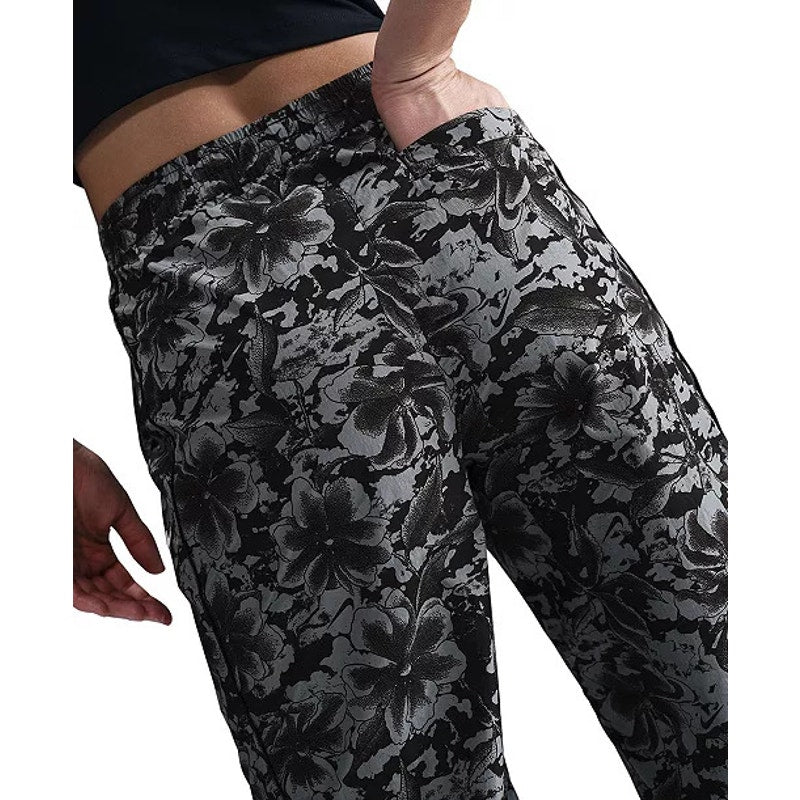 Nike Sportswear women's floral wide leg track pants in black and gray, featuring a floral pattern and relaxed fit.