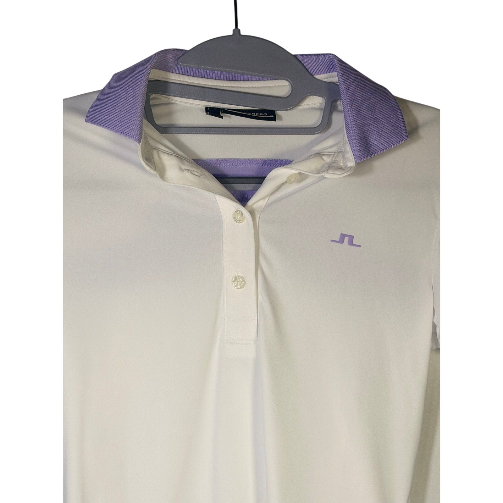 J.Lindeberg women's white and lavender golf polo shirt in size XS, short sleeve, lightweight and stylish for active wear.