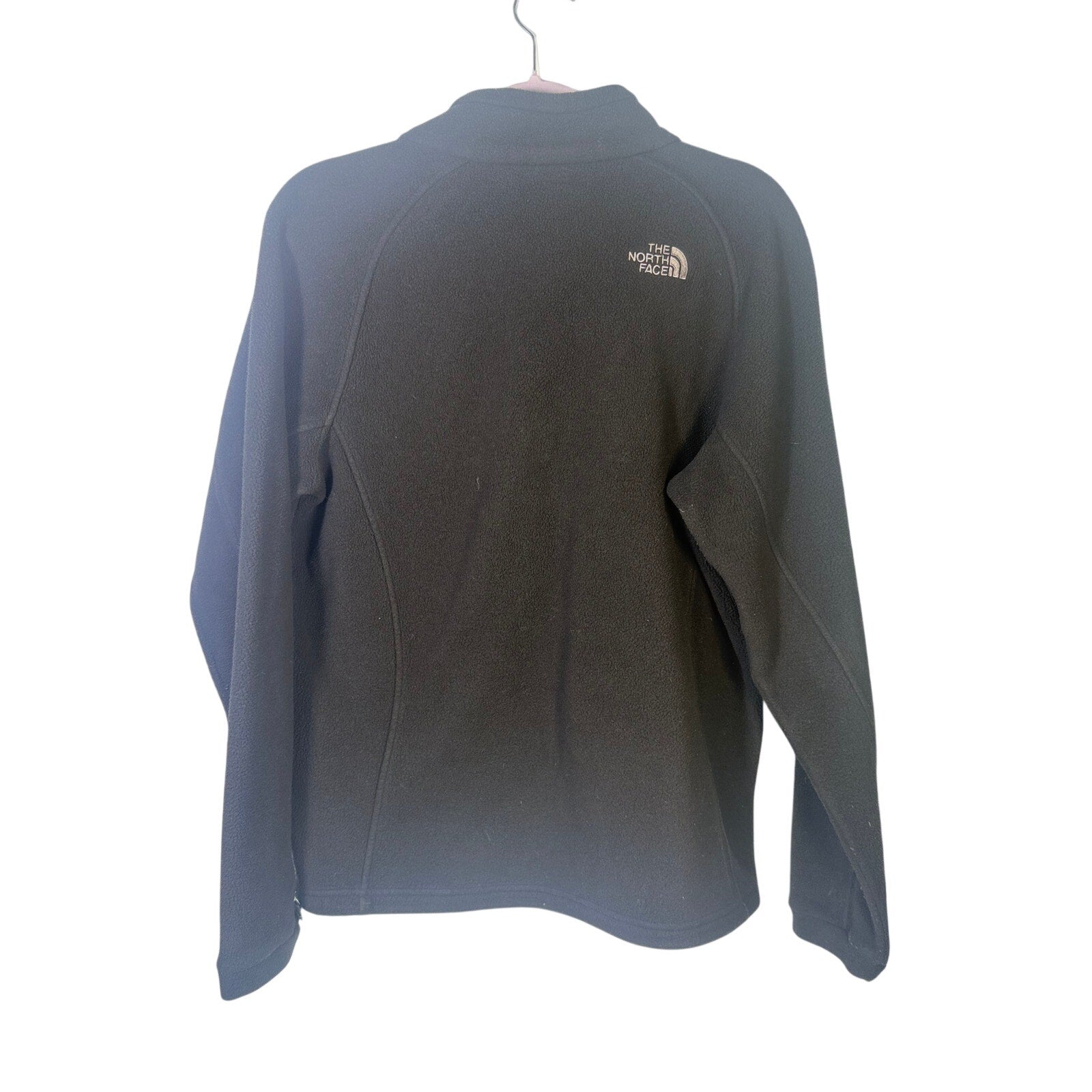 The North Face women's black full-zip fleece jacket with outdoor logo, size XL, featuring a cozy, lightweight fleece design.