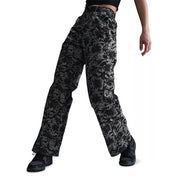 Nike Sportswear women's floral wide-leg track pants in black and gray, featuring a comfortable fit and stylish design.