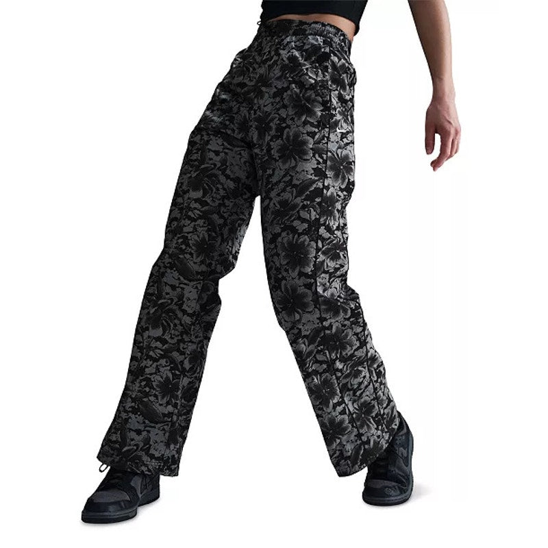 Nike Sportswear women's floral wide-leg track pants in black and gray, featuring a comfortable fit and stylish design.