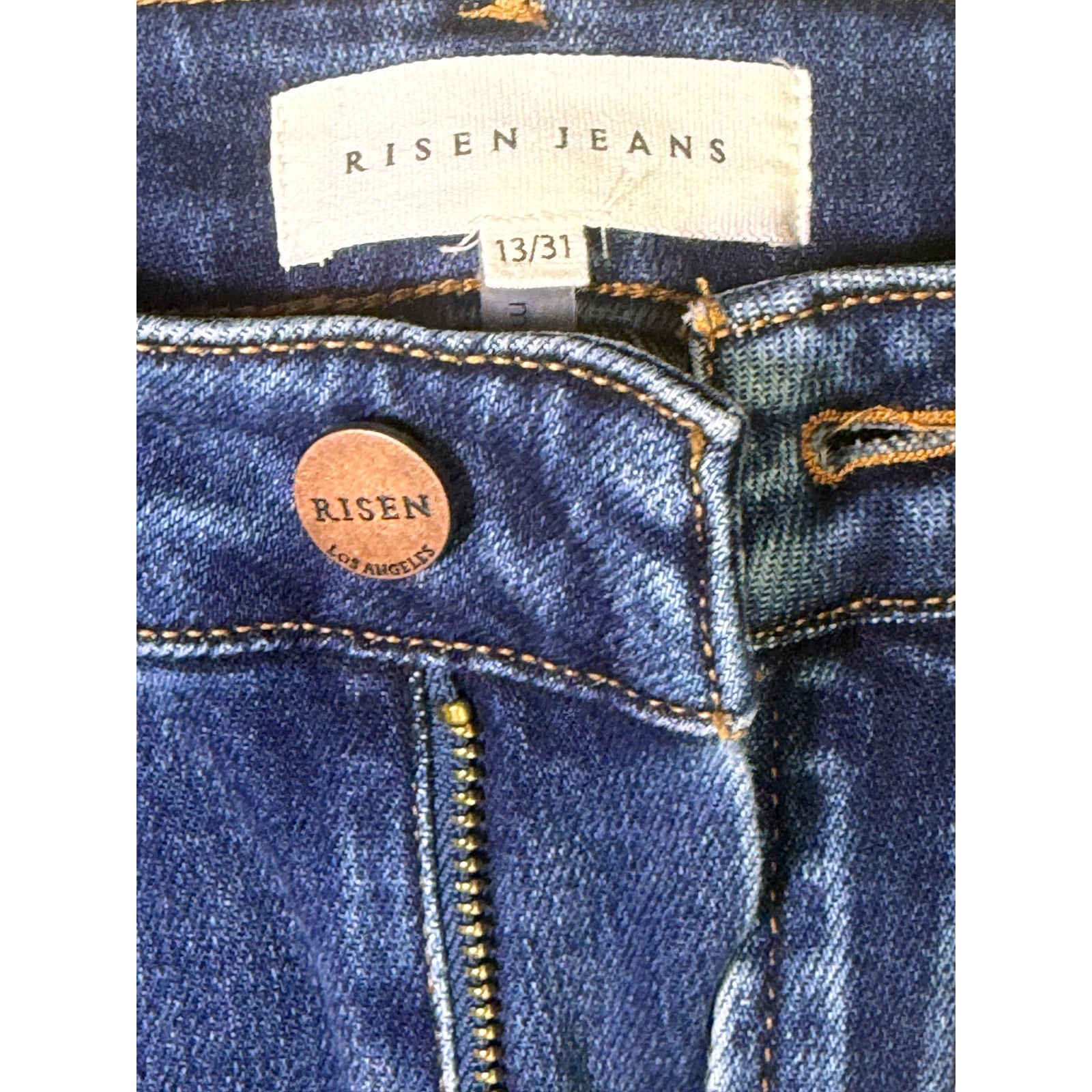 Risen Jeans women's size 13/31 dark wash distressed flare jeans, front view showing fit and style.