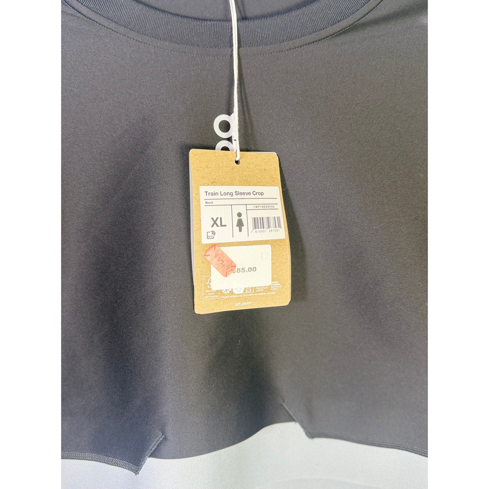 On Women’s black train long-sleeve crop athletic top, size XL, showing the fitted design and breathable fabric.