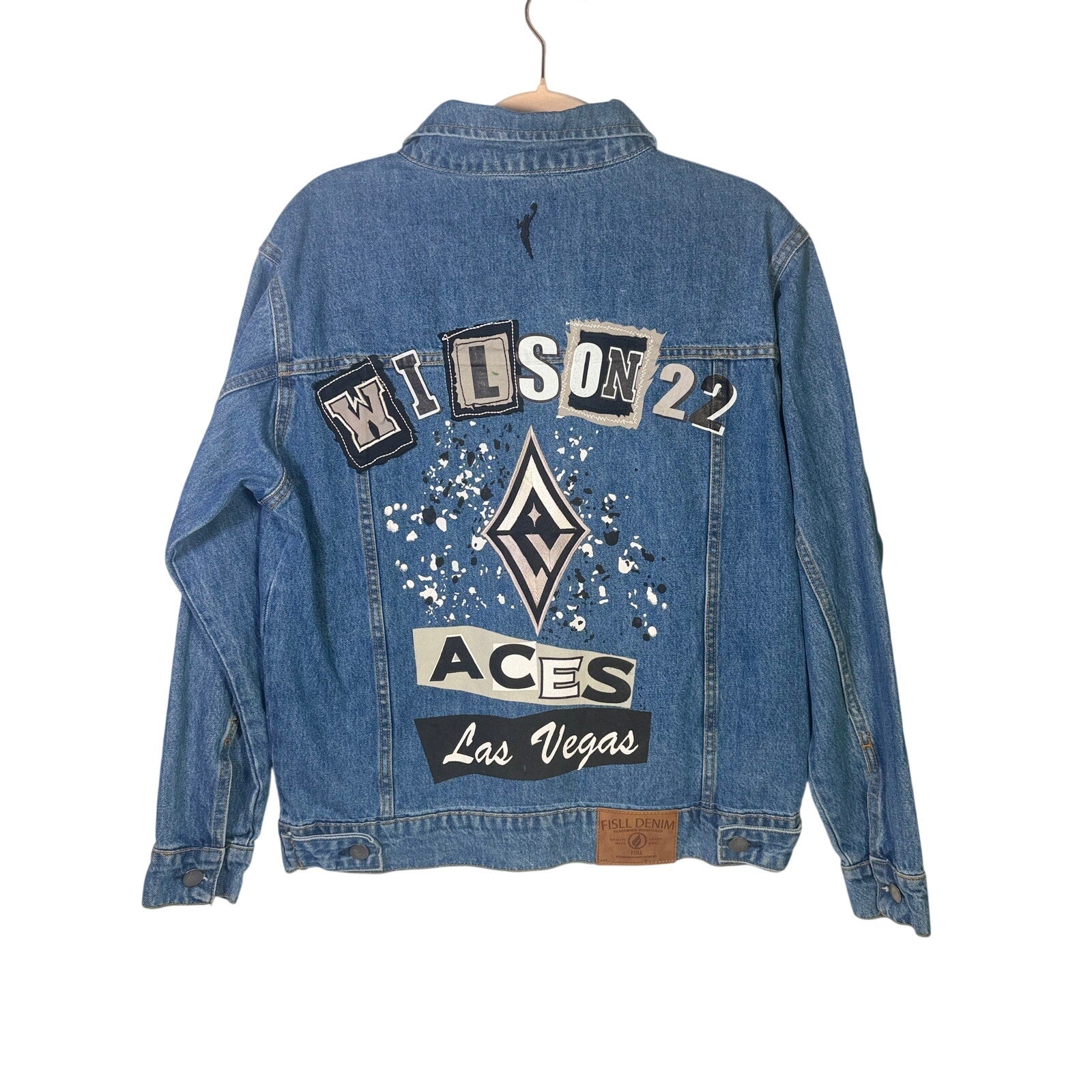 FISLL Las Vegas Aces Wilson denim jacket for women and men, size medium, featuring team logo and classic blue denim fabric.
