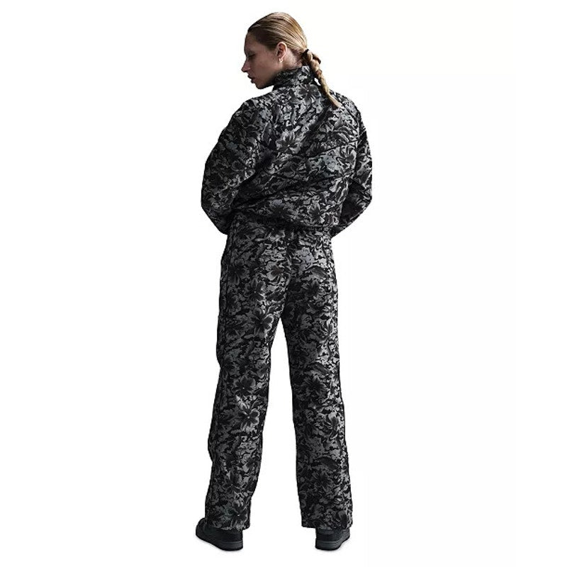 Nike Women's Floral Wide Leg Track Pants in black and gray, featuring a stylish floral pattern and comfortable fit.