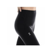 Black On Women’s Train Tights 7/8 leggings in size M, shown laid flat with waistband and smooth fabric.
