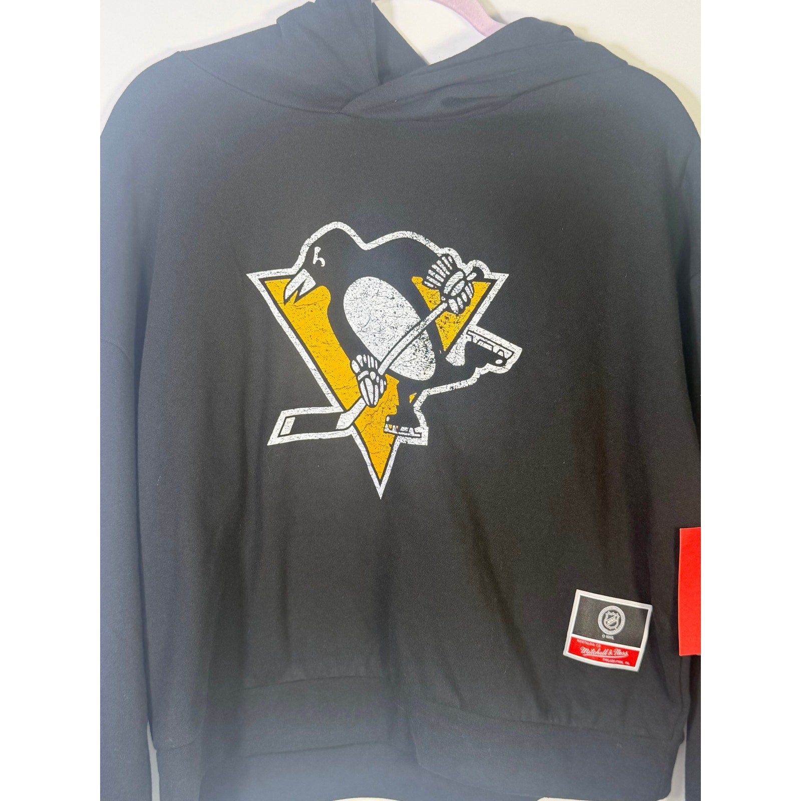 Mitchell & Ness Pittsburgh Penguins NHL Chirp Classic Hoodie for men, medium size, navy blue with team logo and graphic design.