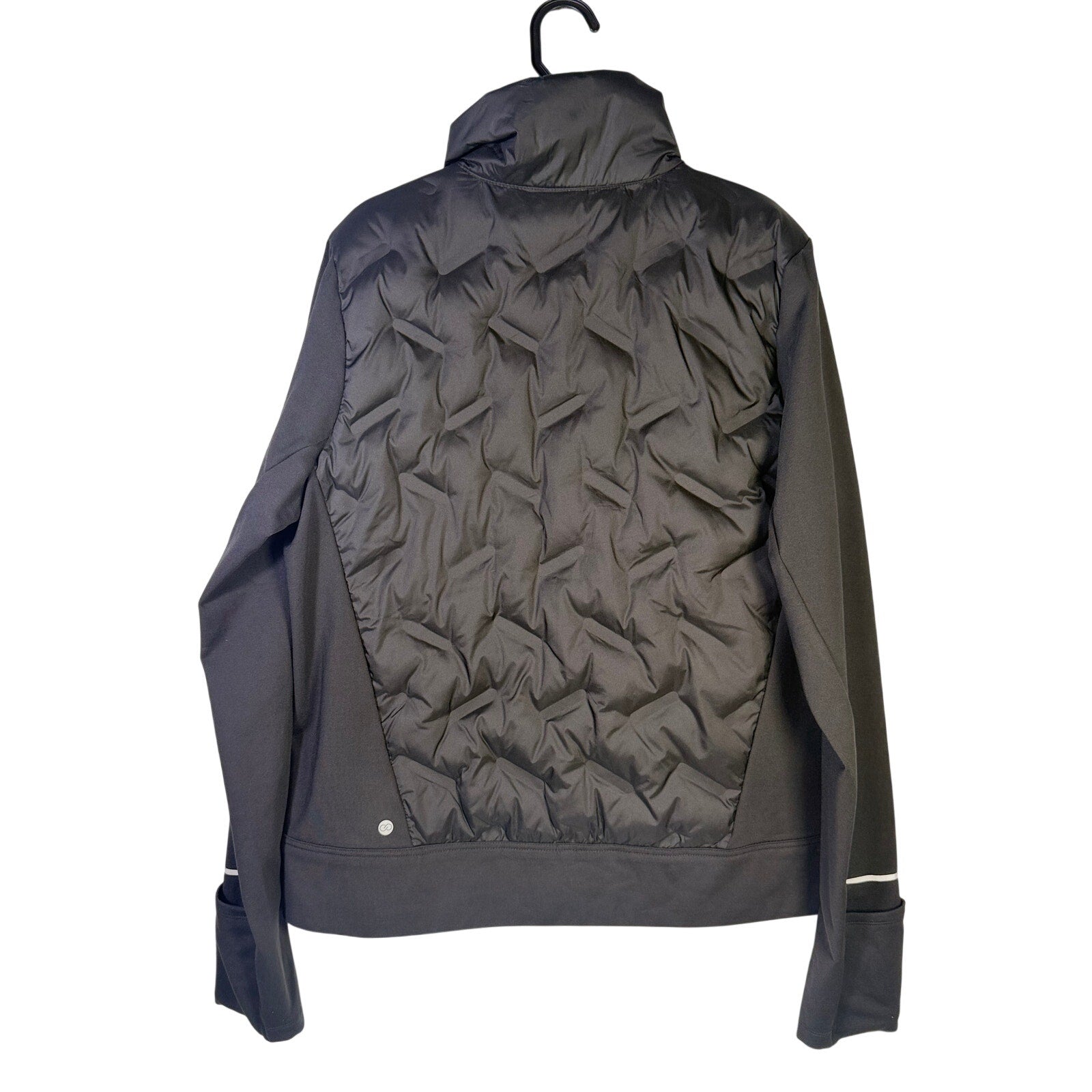 CALIA women's Cold Dash Run Jacket in pure black, medium size, featuring a quilted hybrid design, new with tags.