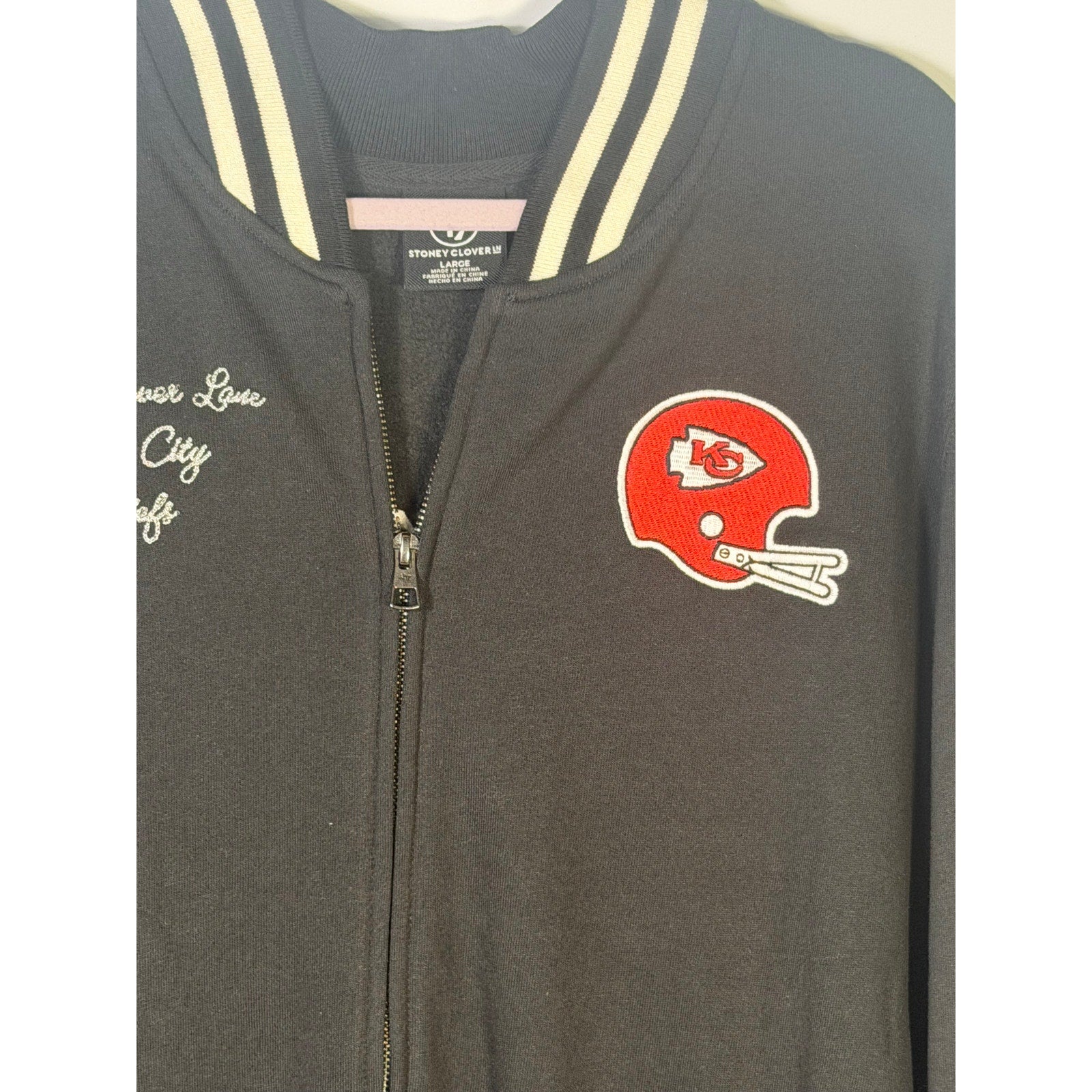 Stoney Clover Kansas City Chiefs women’s varsity jacket in black, large size, with team logo and varsity style details.