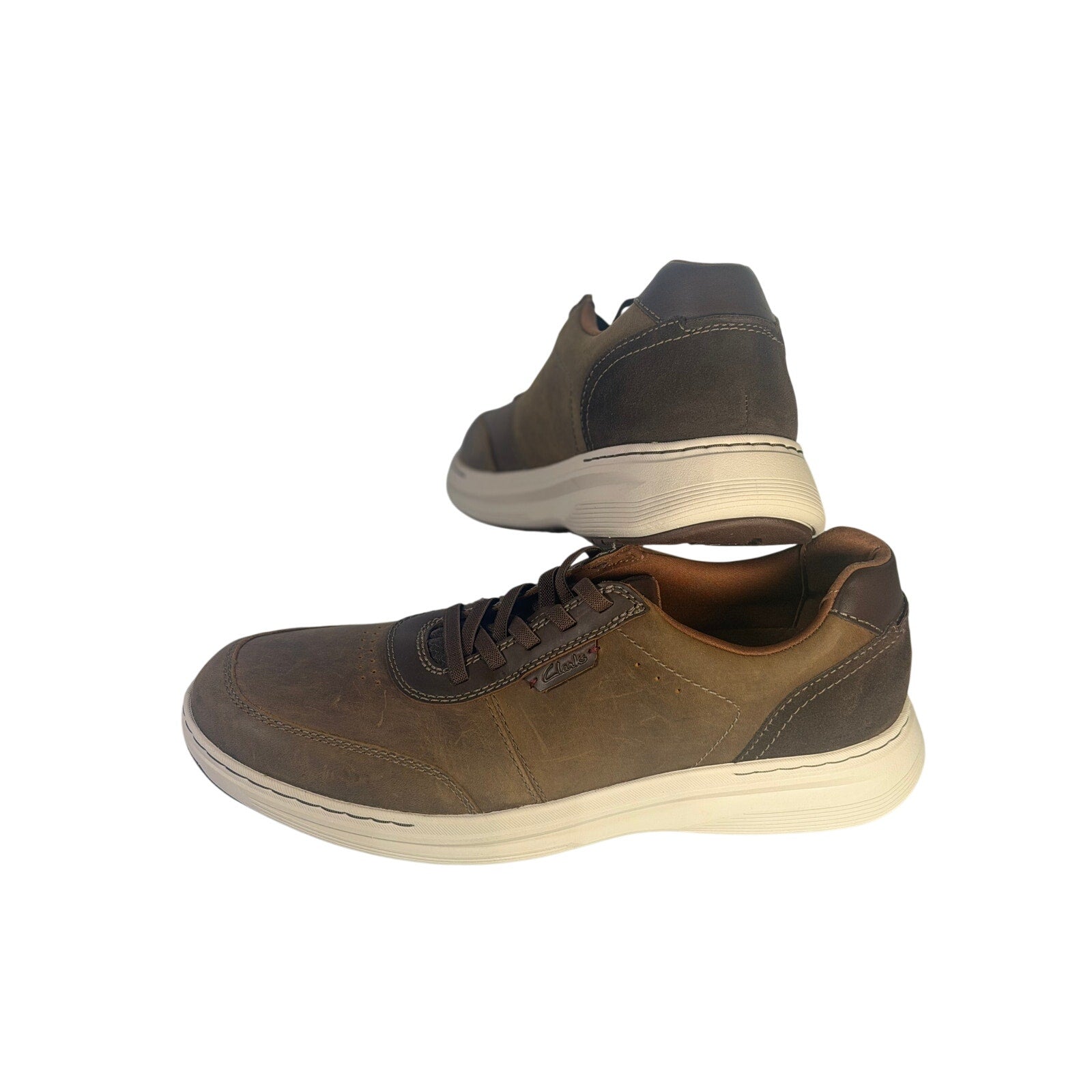 Clarks men's brown casual golf shoes with lace-up design, size 10 M, shown in new condition.